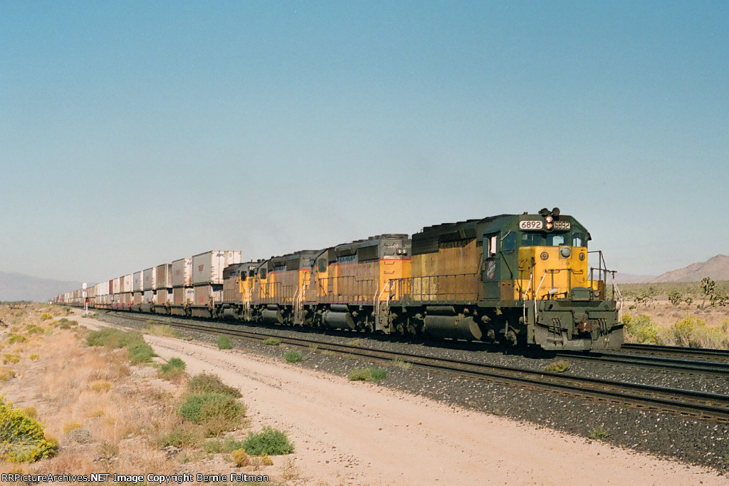 Chicago & Northwestern SD40-2 #6892( with Union Pacific SD40-2's 3604, 3339 & 3315), easing to a stop at the west absolute signal, to participate in a 3-way meet 